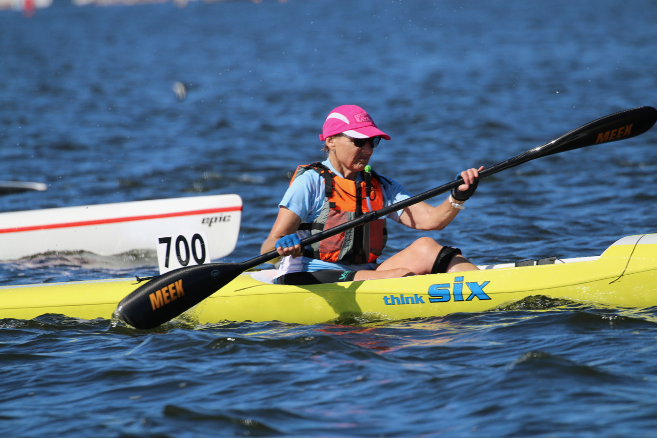 Robyn paddling a yellow ski at the Brisbane Waters Marathon - 2021