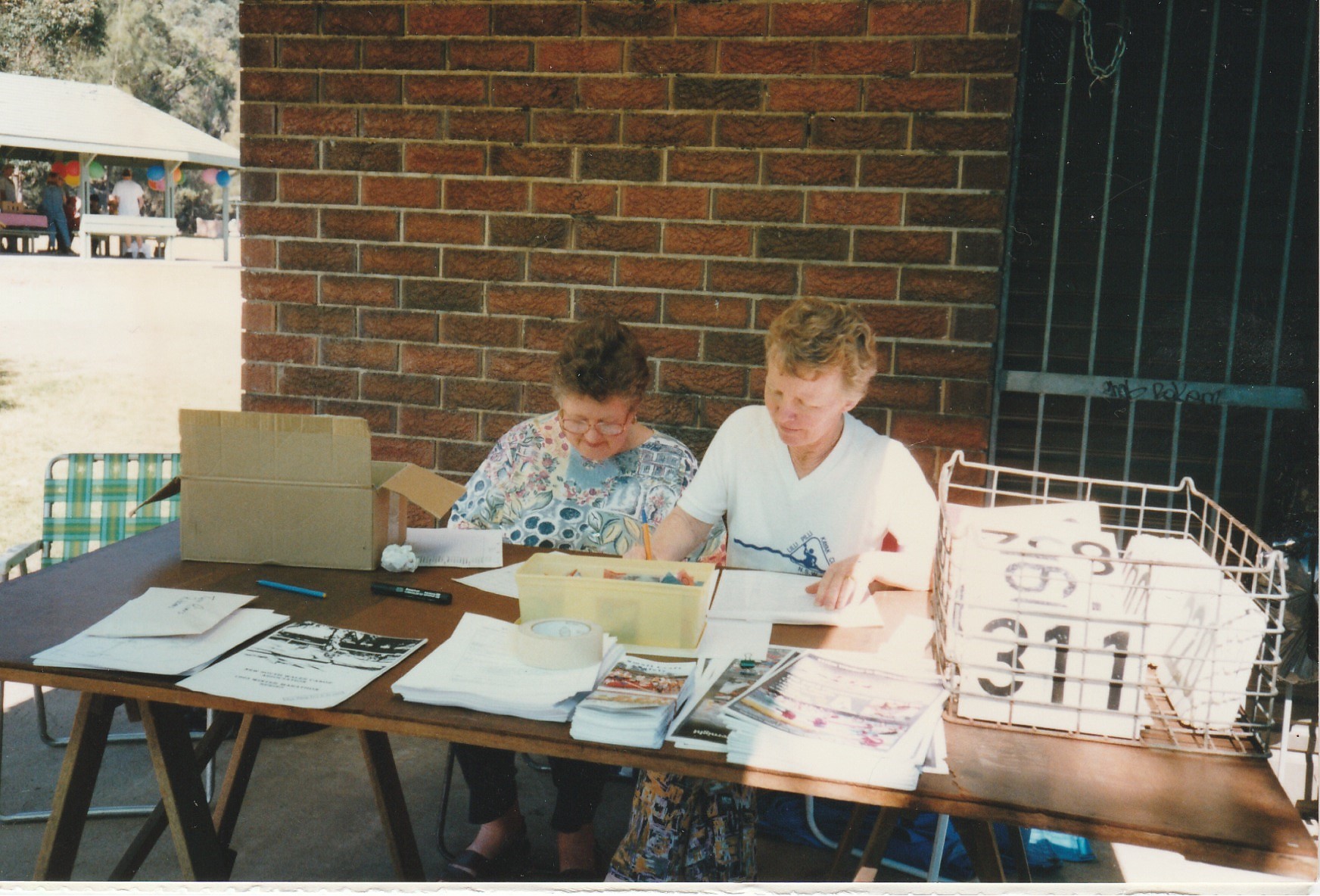 2003 Kaye Laurendet (on the right with another lady club member on the left)) at the Twin Rivers Marathon check-in
